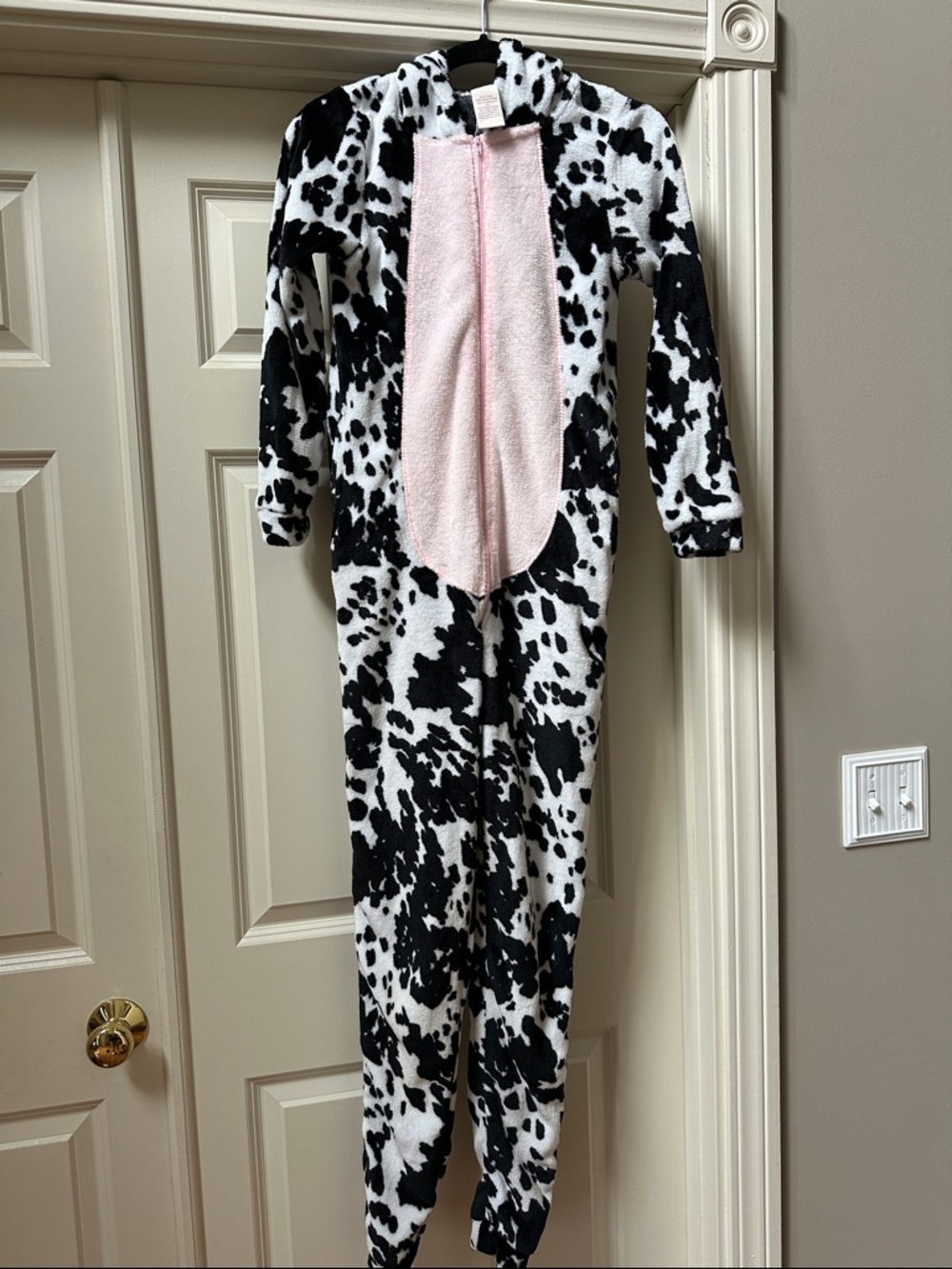 Black & White Cow Print women’s Onesie with Pink Front